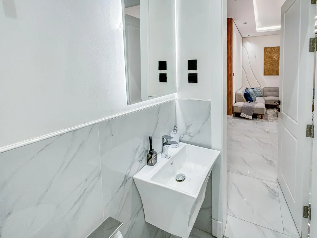 Bright marble powder room